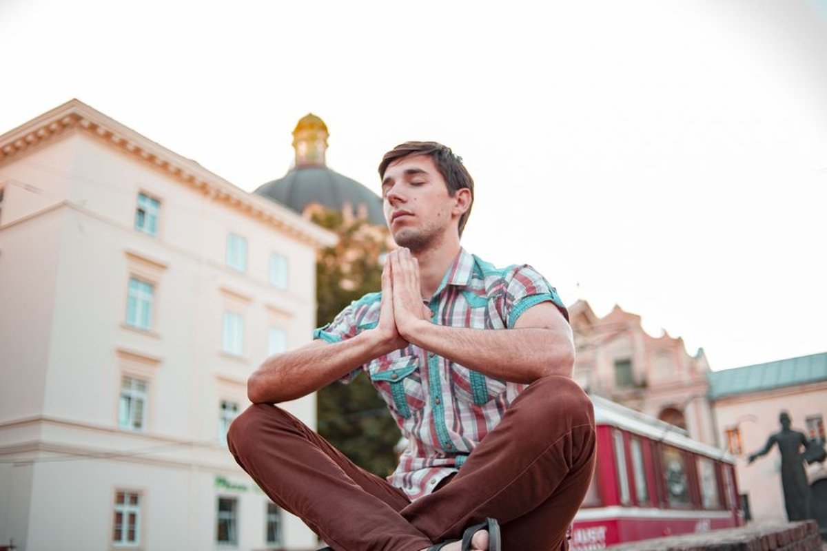 Young man walks in the city example image 1