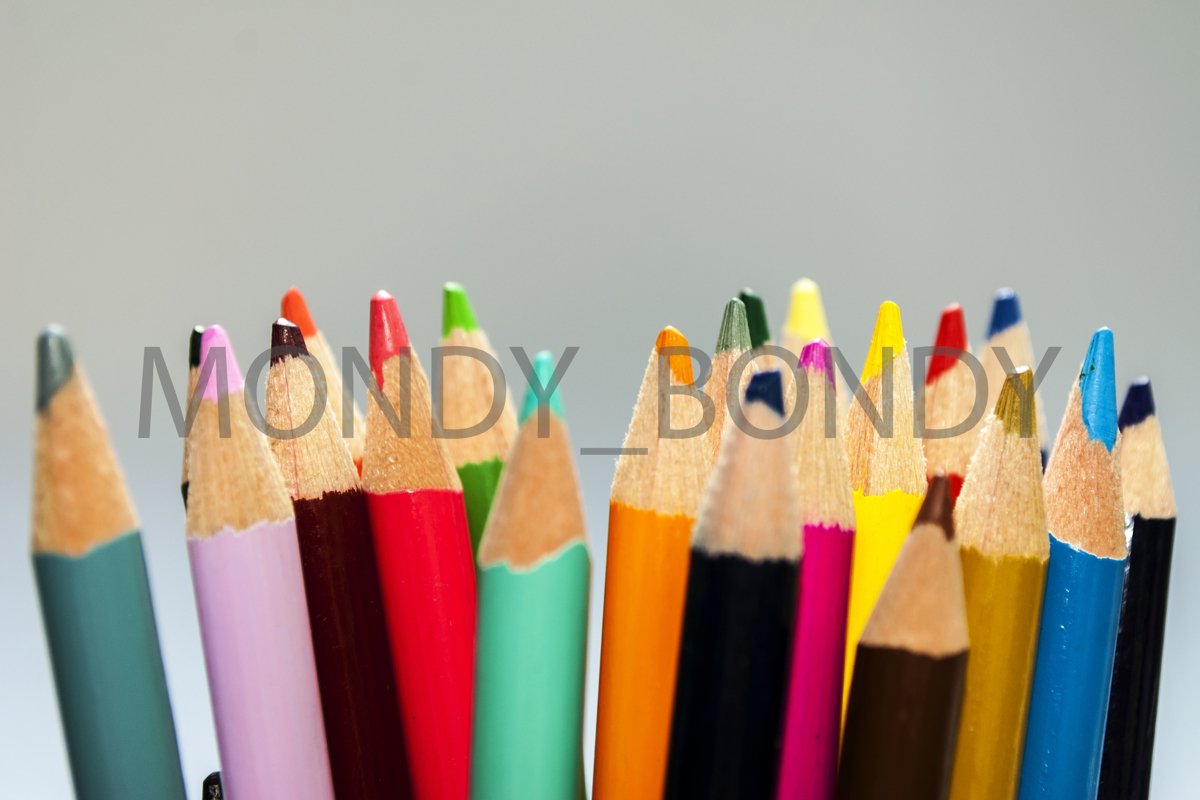 Color pencils on a white background close-up example image 1
