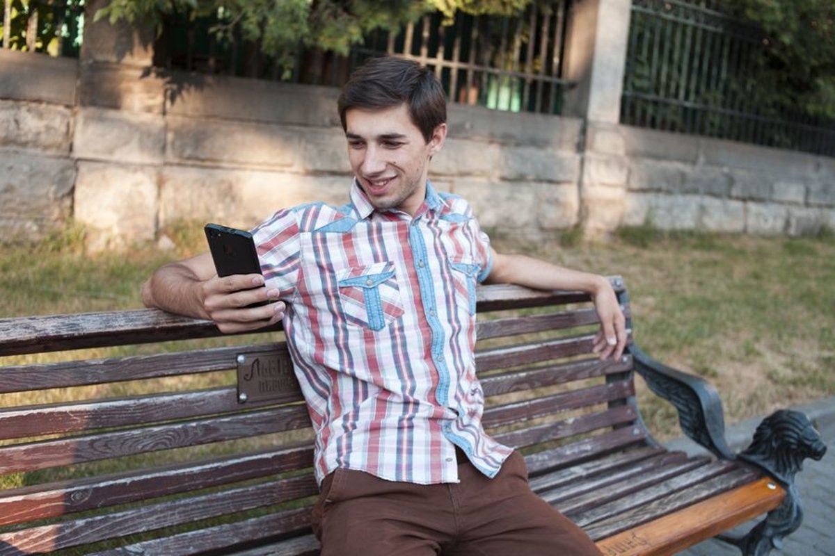 Young man walks in the city example image 1