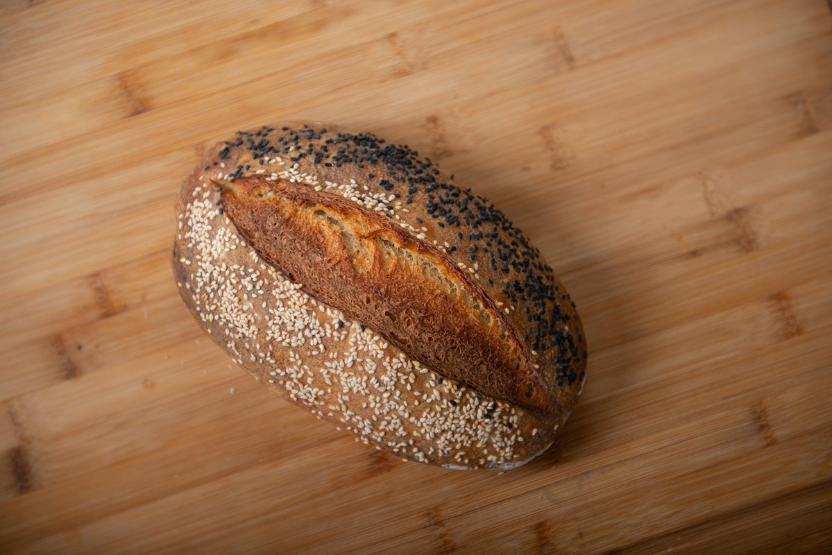 craft bread is sprinkled with white and black sesame seeds example image 1