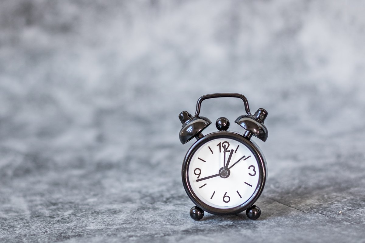 Black retro alarm clock on a vintage dark background example image 1