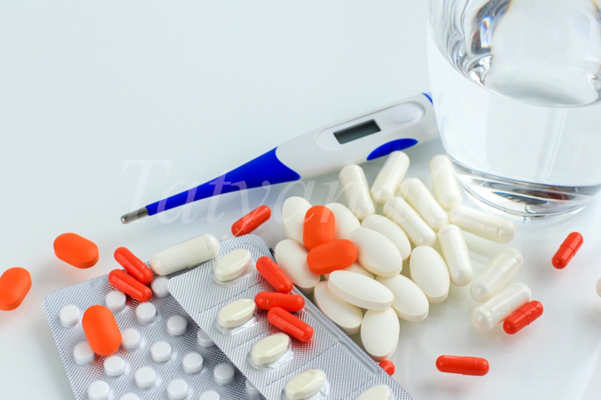 Multicolored pills, tablets against the virus, flu, disease example image 1