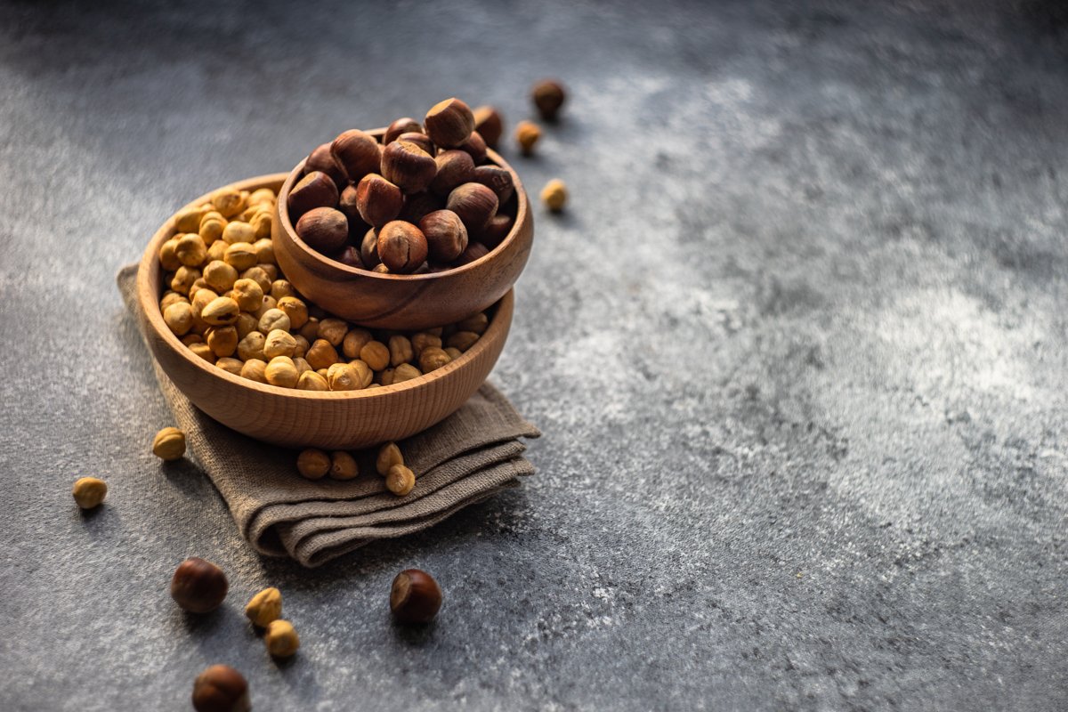 Different types of hazelnuts on dark wooden background example image 1