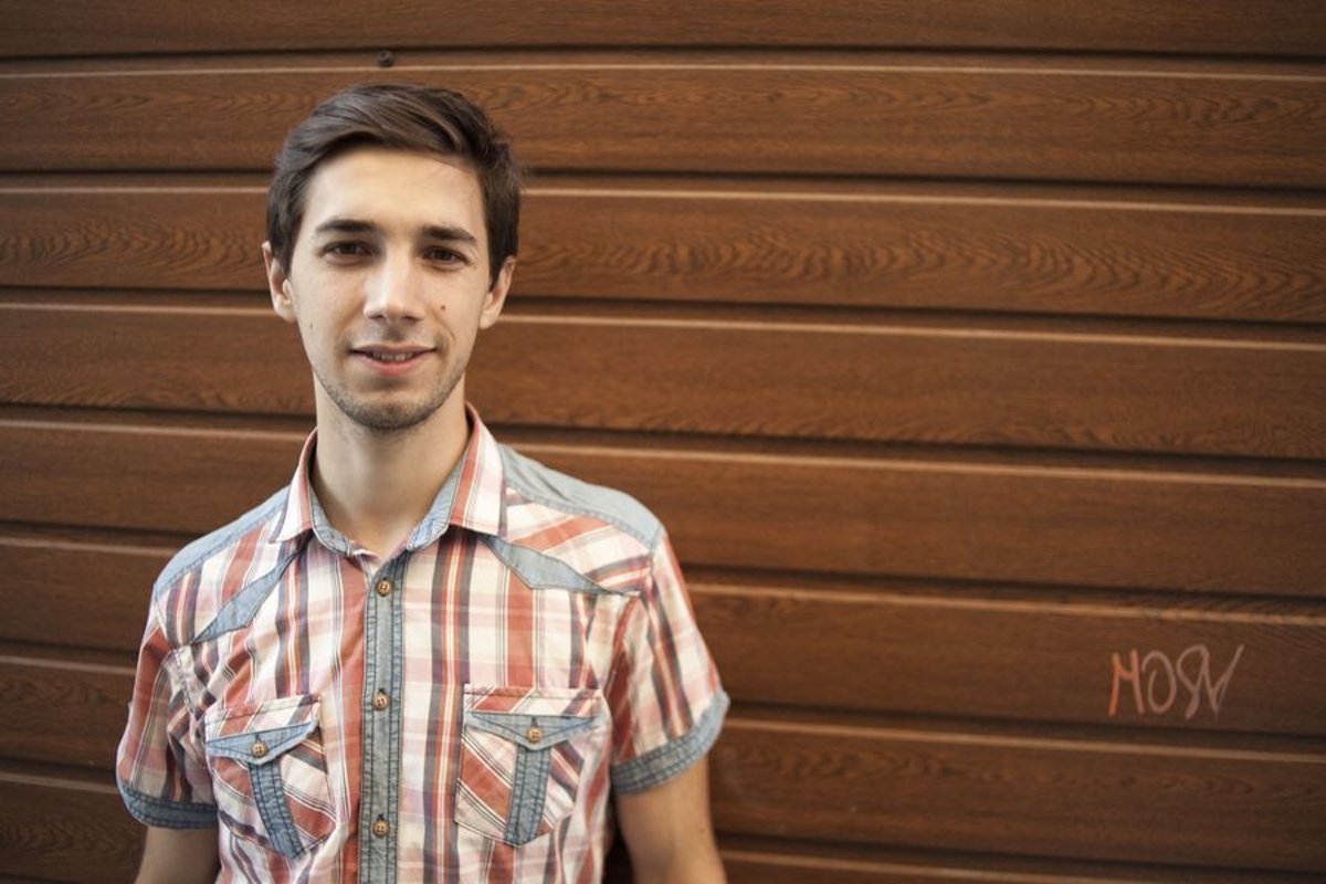 Young man walks in the city example image 1