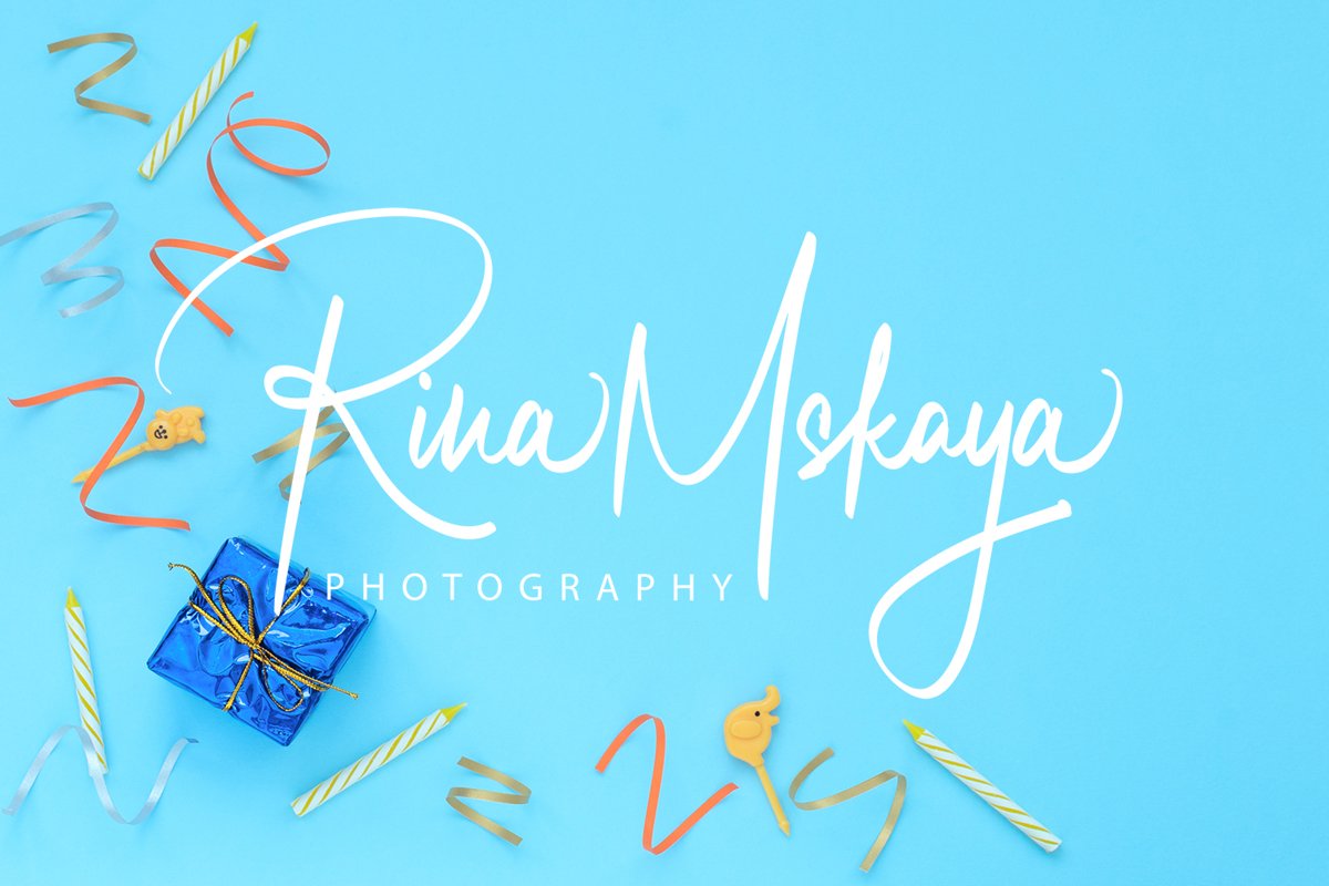 Blue background with wrapped giftboxes, streamers, candles example image 1