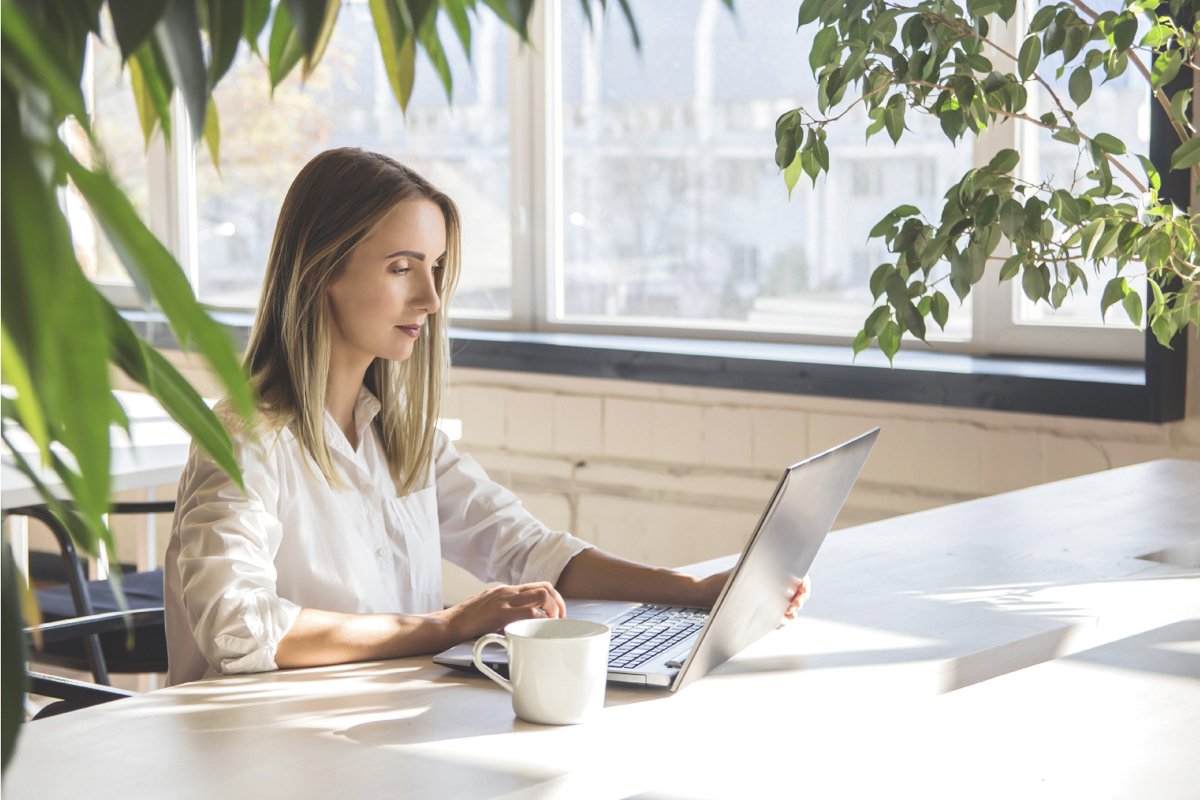 Beautiful caucasian girl working on a laptop remotely. example image 1