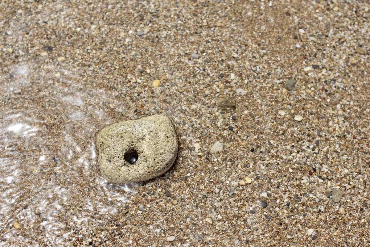 A large stone with a through hole example image 1