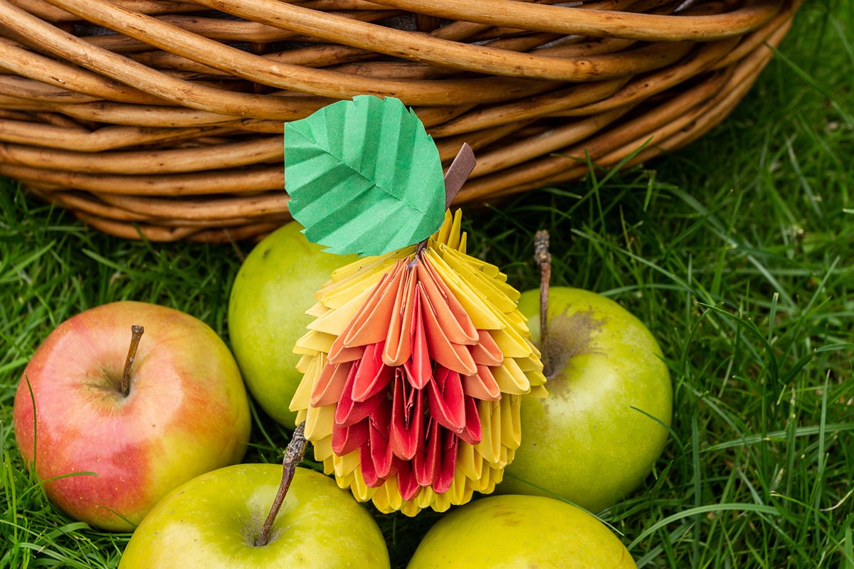 Autumn Apple harvest background wicker basket on green grass example image 1