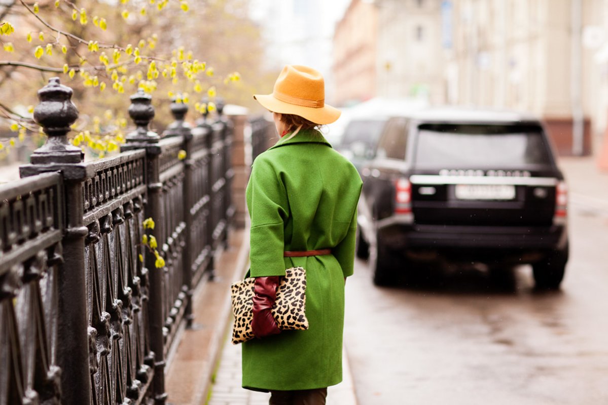 Details of clothes, girl in a green coat and brown hat example image 1