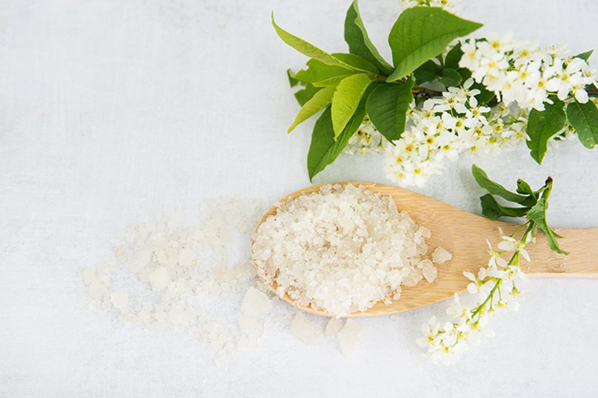 Spa-sea salt in a wooden spoon and shells example image 1