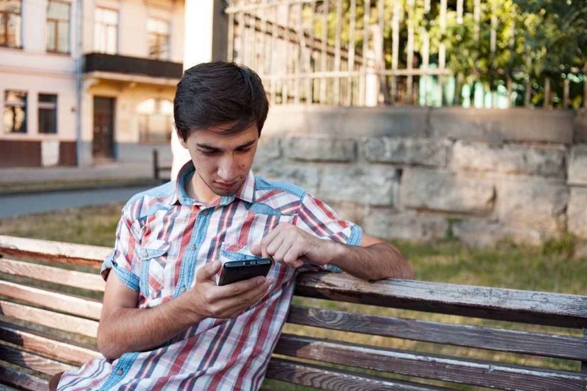 Young man walks in the city example image 1