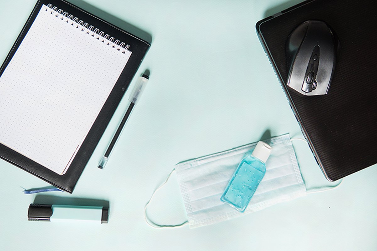 Top view of a desktop with notebooks, marker and laptop. example image 1