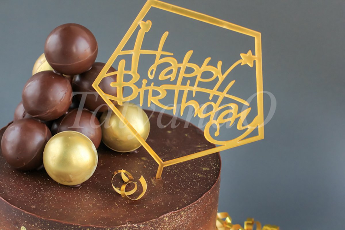 Chocolate birthday cake with gold decorations. example image 1