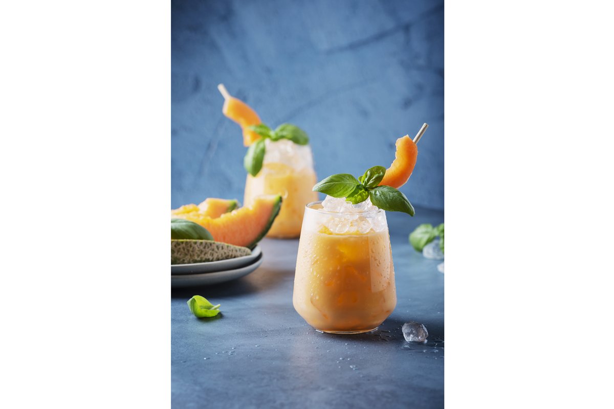 Bar concept. Sweet summer liquor with melon, ice and basil example image 1