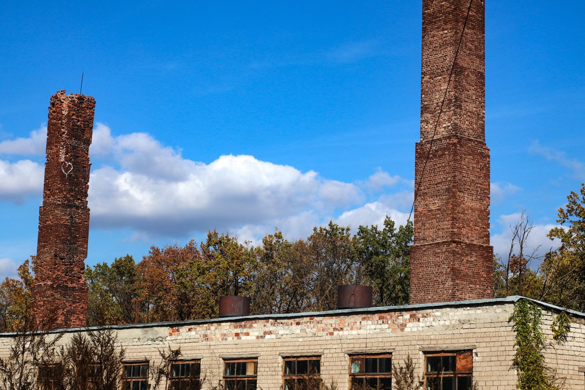 old brick building with two pipes example image 1