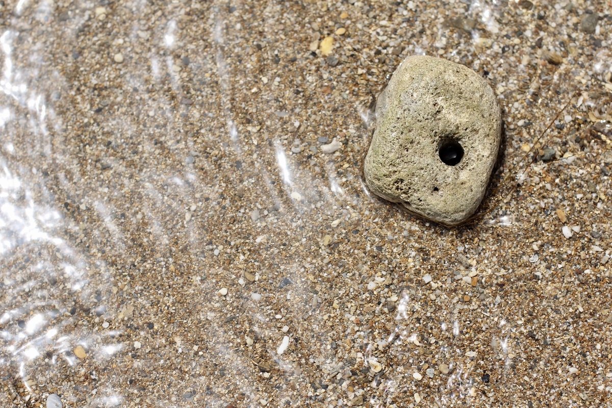 A large stone with a through hole example image 1