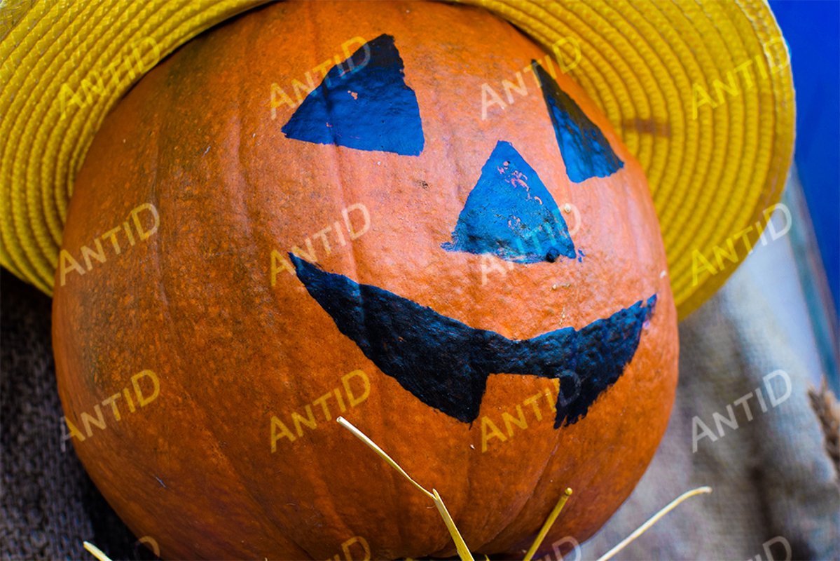 Jack-o-lantern with a yellow hat. Halloween example image 1