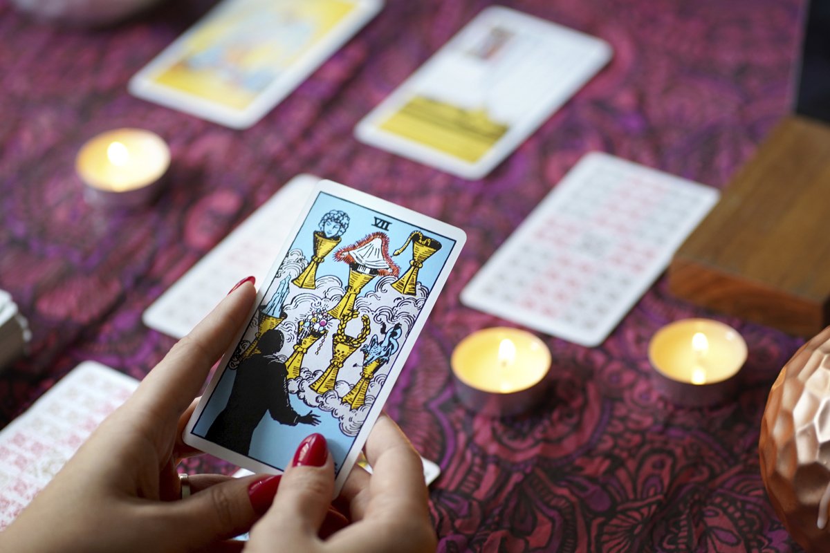 Tarot reader picking tarot cards. example image 1