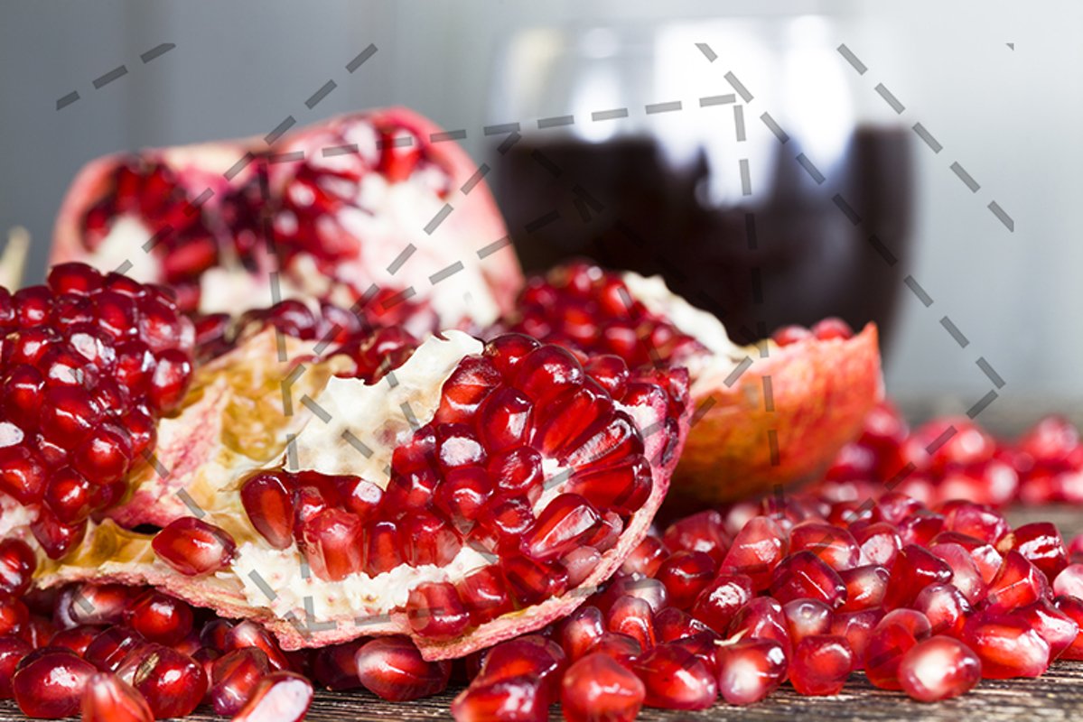 Open red juicy pomegranate example image 1
