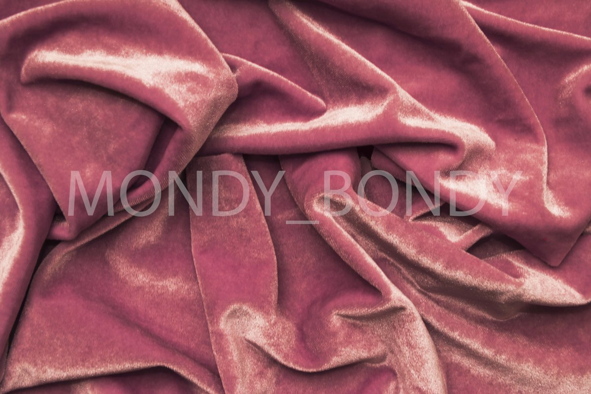 Texture of pink velvet fabric with irregular folds. example image 1
