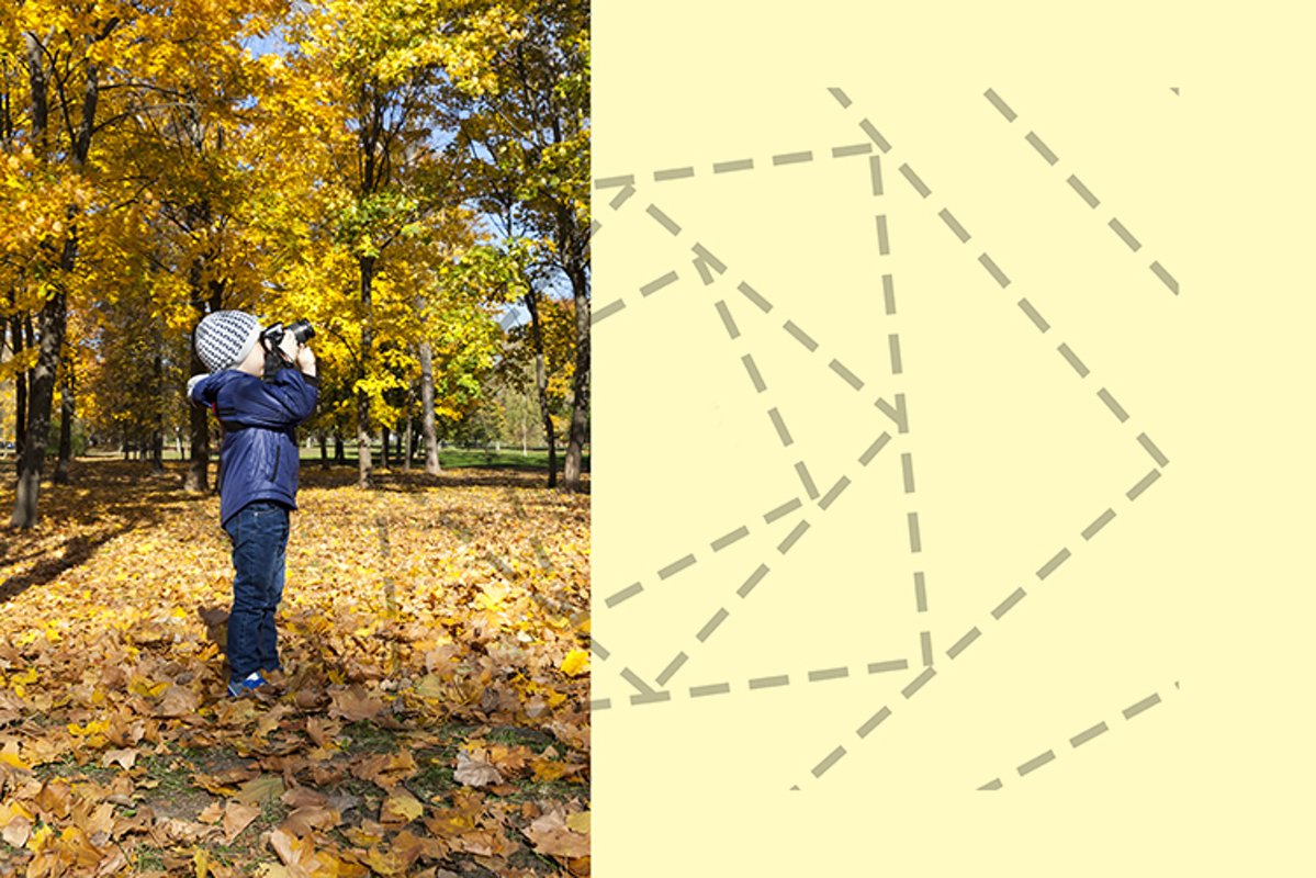 A boy with a camera in the park example image 1