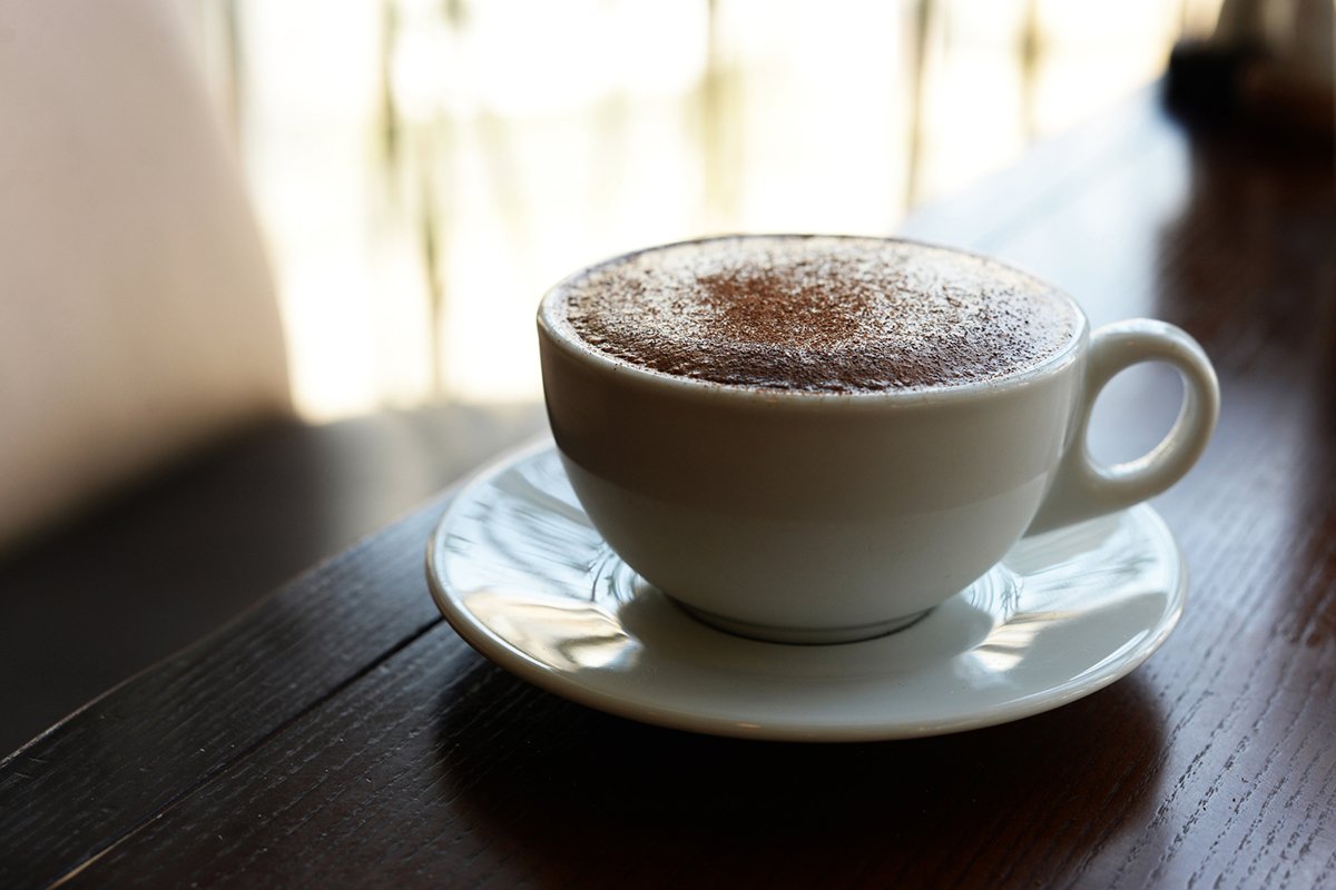 delicious hot cappuccino hot coffee in a white cup example image 1