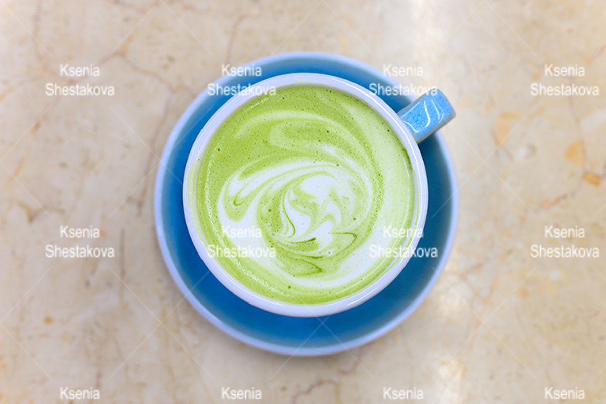 matcha green tea cup latte with a pattern of milk foam example image 1