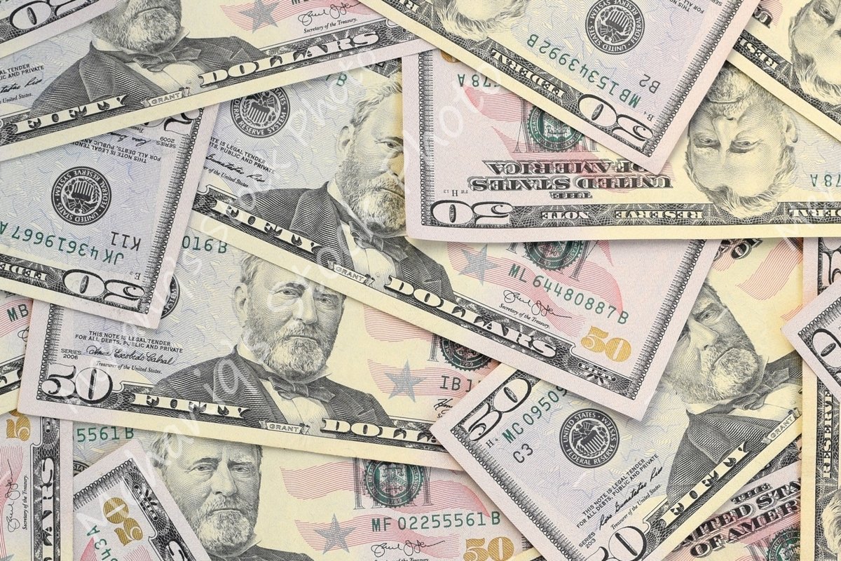 Many american dollar bills close up example image 1