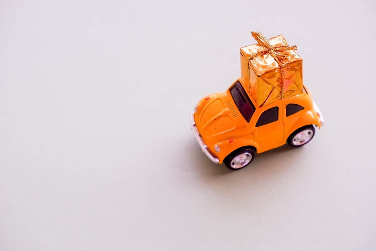 small toy car and present. Delievery example image 1