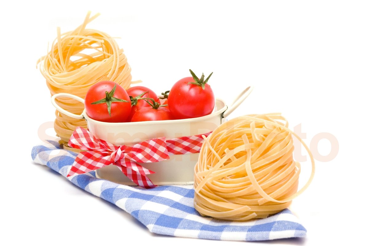 Pasta nest and red tomatoes cherry on plaid napkin example image 1