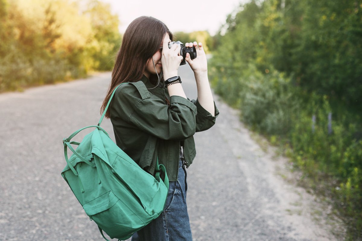 Cute brunette looks at the camera lens. example image 1