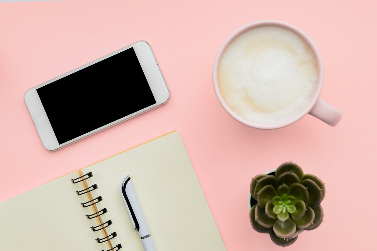 workspace with smartphone, blank notepad, pen, cup of coffee example image 1