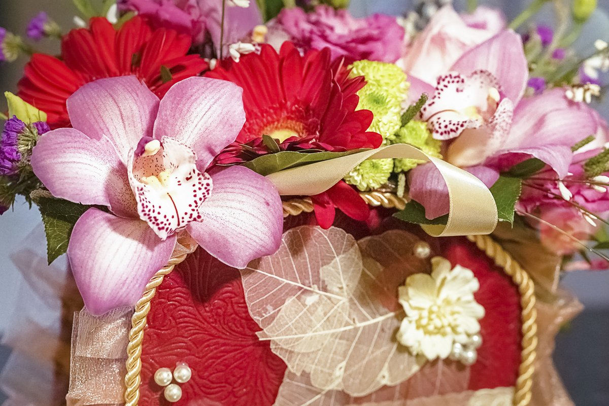 flower composition in basket on defocused background example image 1