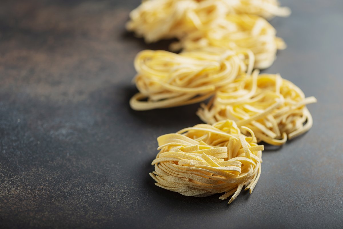 Traditional italian raw pasta tagliatelle example image 1