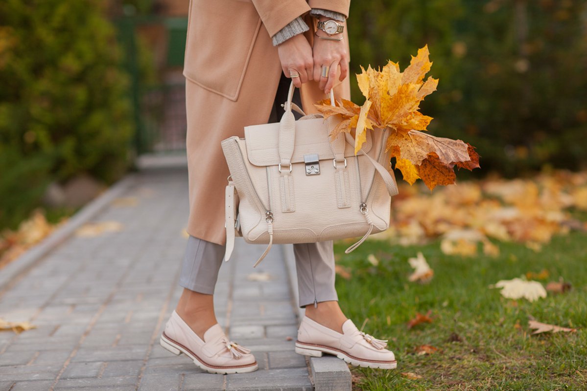 Details of clothes, autumn image of a girl, coat and bag example image 1