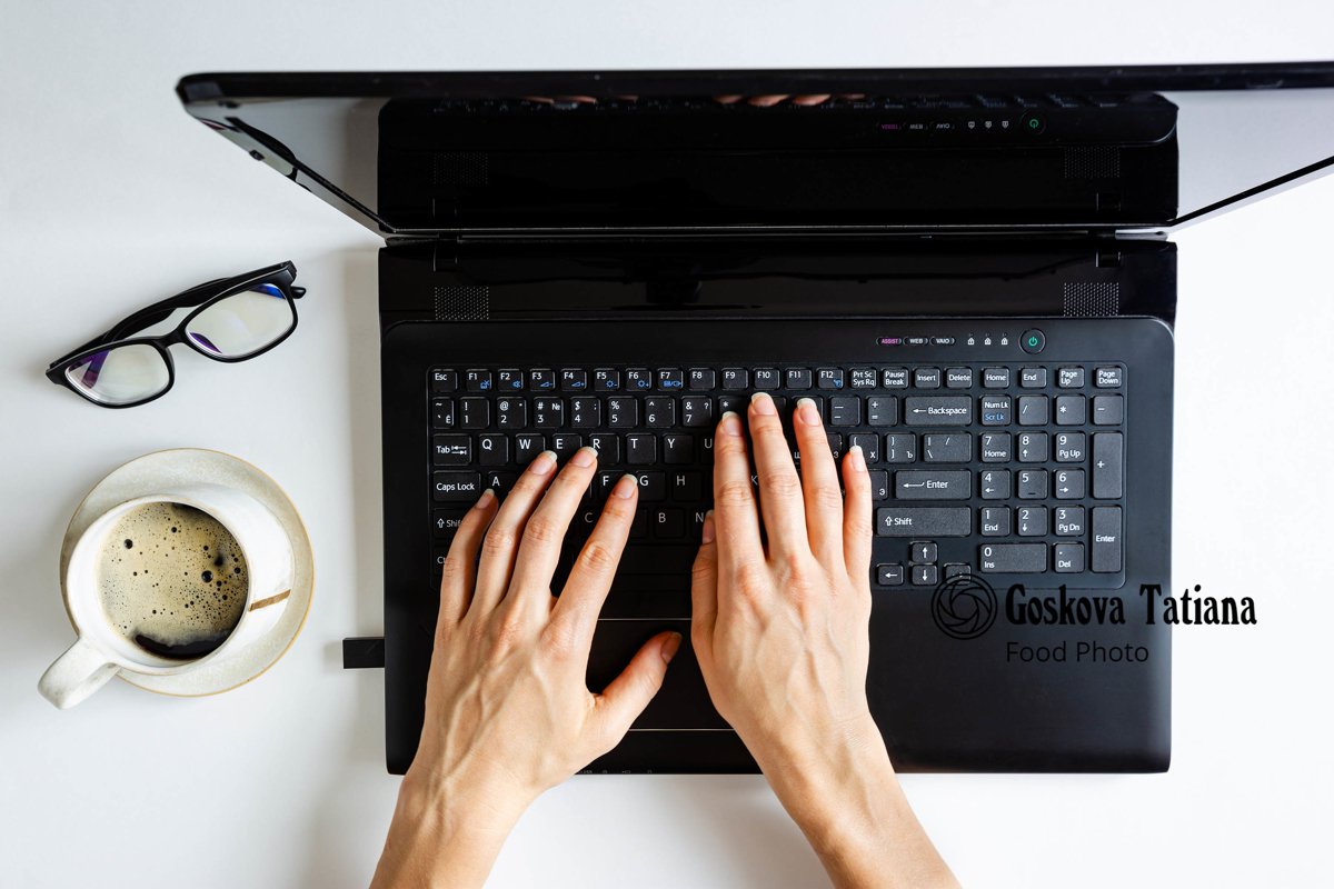 Photo of black laptop and girls hands example image 1