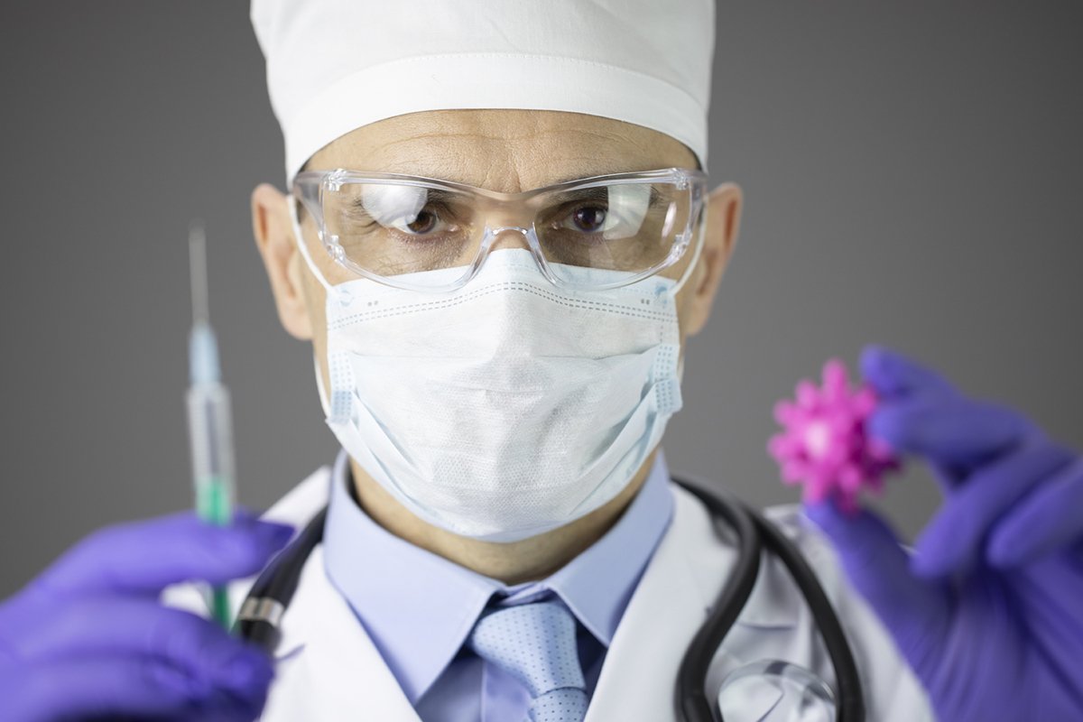 Doctor therapist with a stethoscope on a pink background example image 1