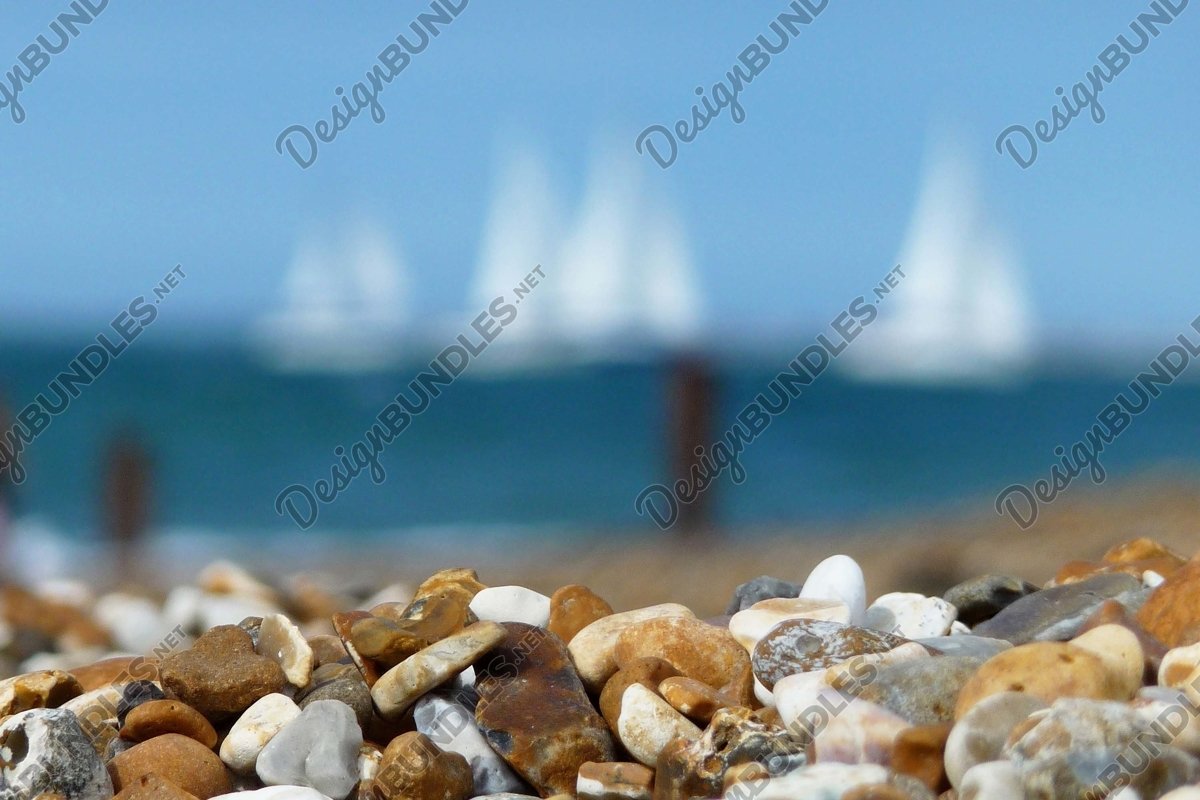 Stock Photo - Close up of pebbles on rocky beach example image 1
