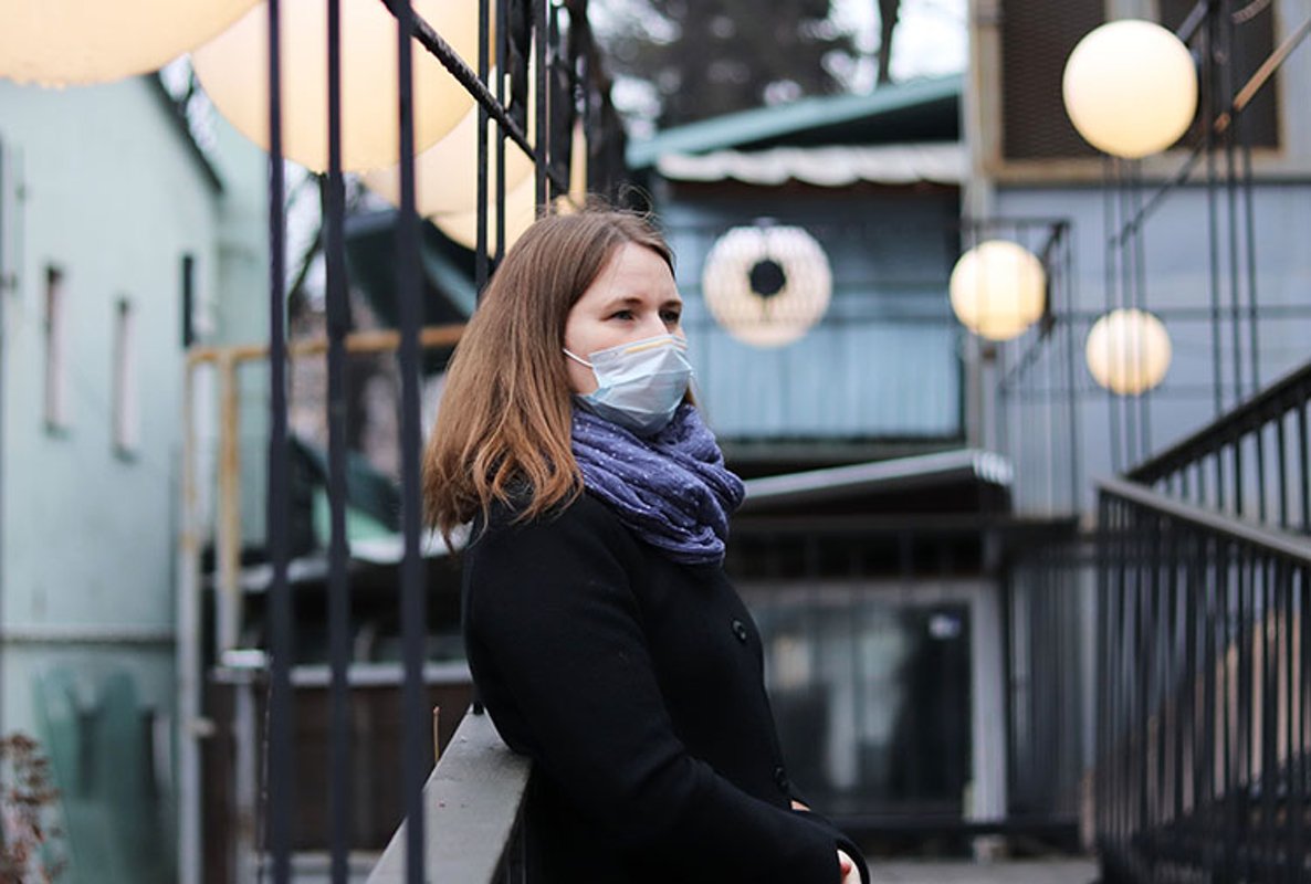 young european woman in protective disposable medical mask. example image 1
