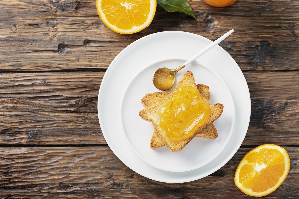 Traditional italian breakfast with Toast bread and oranges example image 1