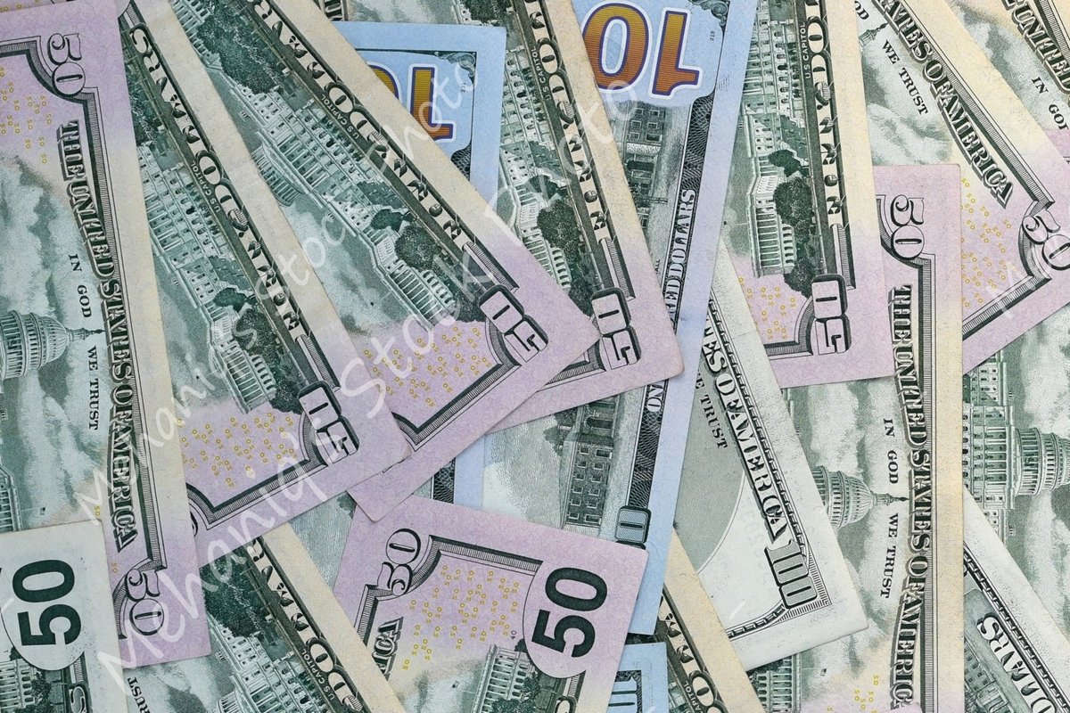 Many american dollar bills close up example image 1