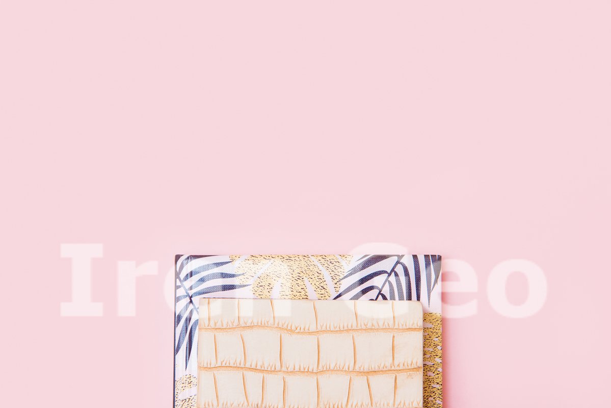A stack of notebooks on a pink background example image 1