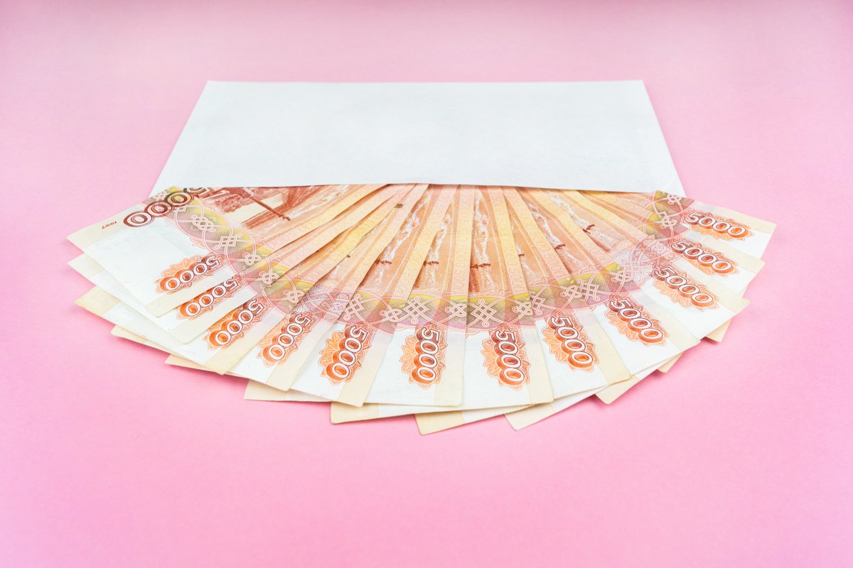 envelope with Russian currency on a pink background example image 1