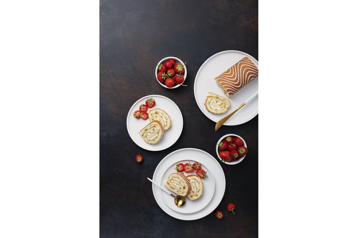 Sweet roll cake with white biscuit, cream and strawberry example image 1