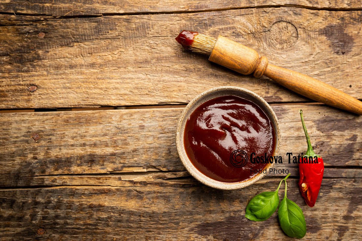 Photo of Barbecue sauce in a saucer with basting brush example image 1