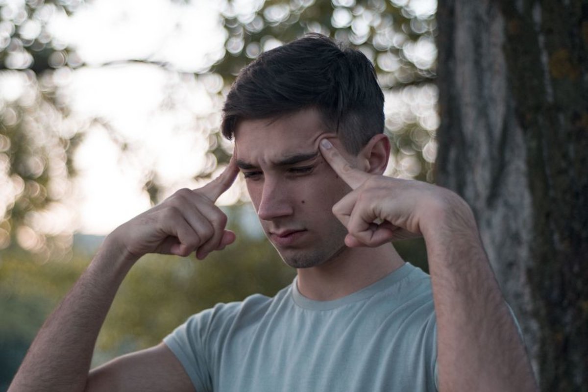 Young caucasian man walks in a park example image 1