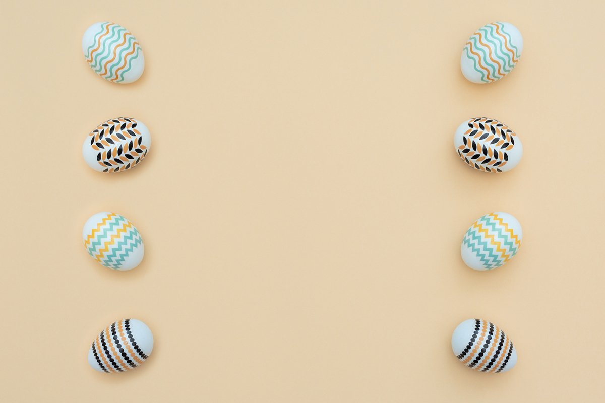Decorated Easter eggs lie on the yellow background. example image 1