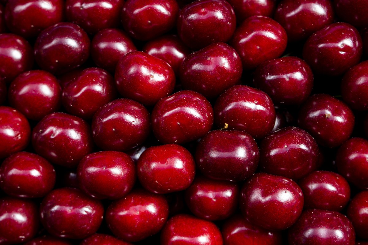 Juicy colored fruits on counter farm market red cherry example image 1