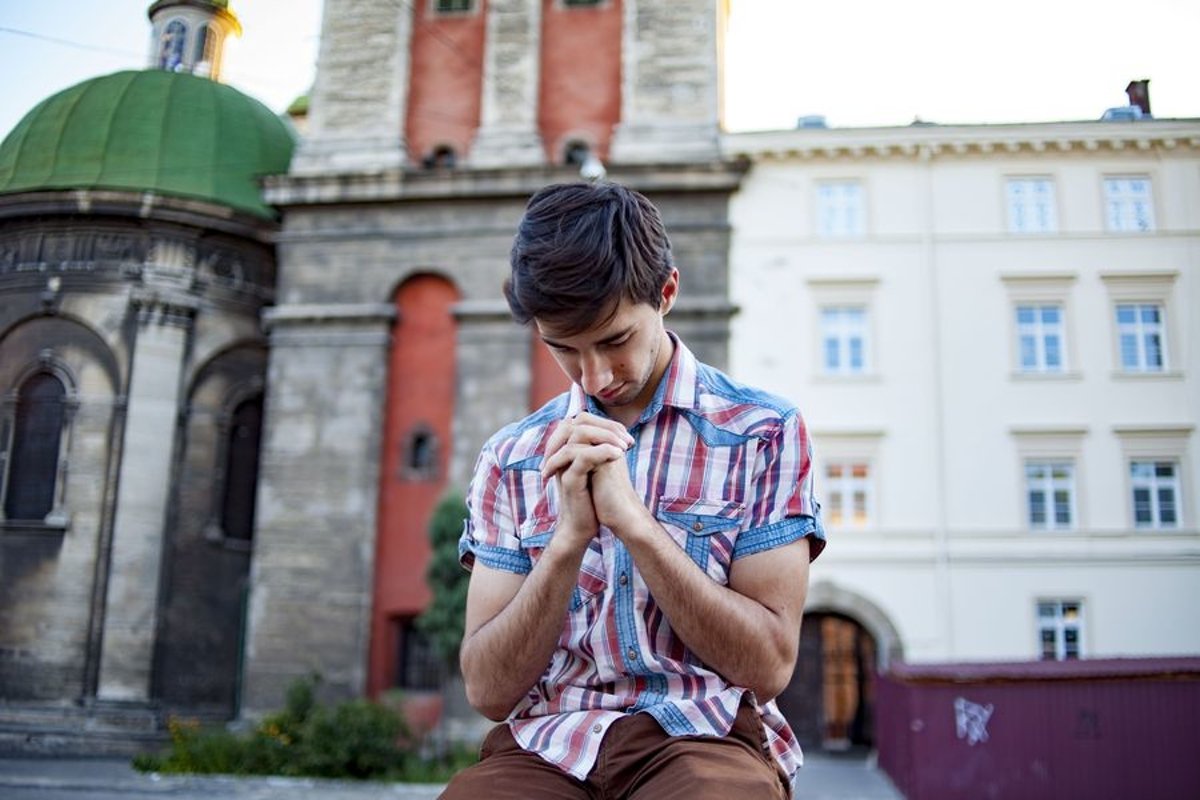 Young man walks in the city example image 1