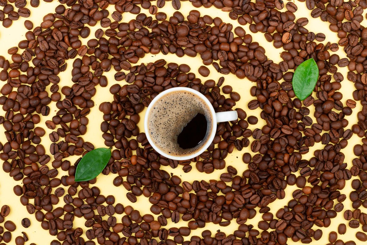 Fresh coffee and coffee beans on the table example image 1
